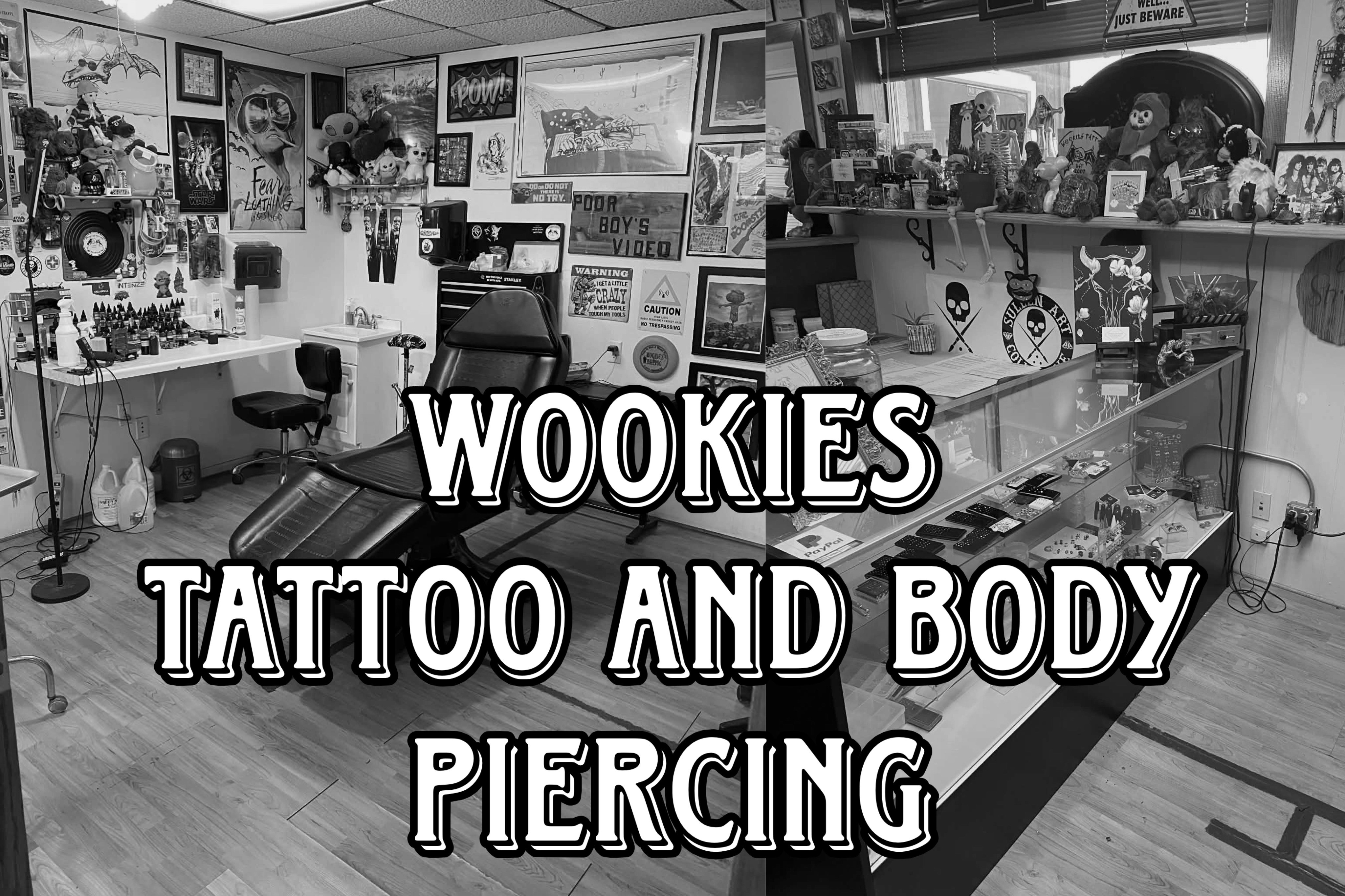 backdrop showing the interior of the tattoo parlor with art and posters covering the walls around the tattoo bed and the counter full of more art and body jewelry. Wookies Tattoo and Body Piercing imposed in bold text overtop.